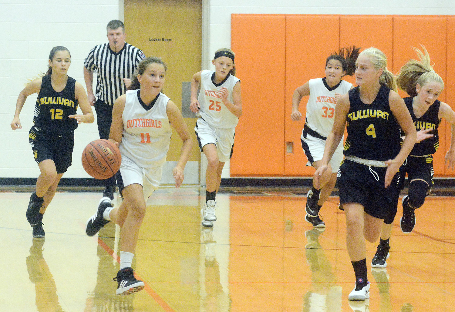 Cameron Ryerson (above, second from left) drives down the court for Owensville’s seventh-grade Dutchgirl basketball team last Tuesday night in their season opener against Sullivan’s Lady Eagles at Owensville Elementary School. Other seventh-grade girls basketball players running down the court (above, from left) include Sullivan’s Ella Kirk, Owensville’s Cameron Slinkard, Owensville’s Lainey Moss, Sullivan’s Kaydence Bollinger and Sullivan’s Lily Schmuke. Owensville’s seventh and eighth-grade basketball teams are in tournament action this week at Hermann and Washington respectively.